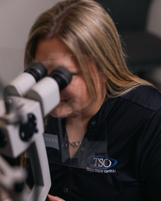 Optometrist examining a patient during an eye exam