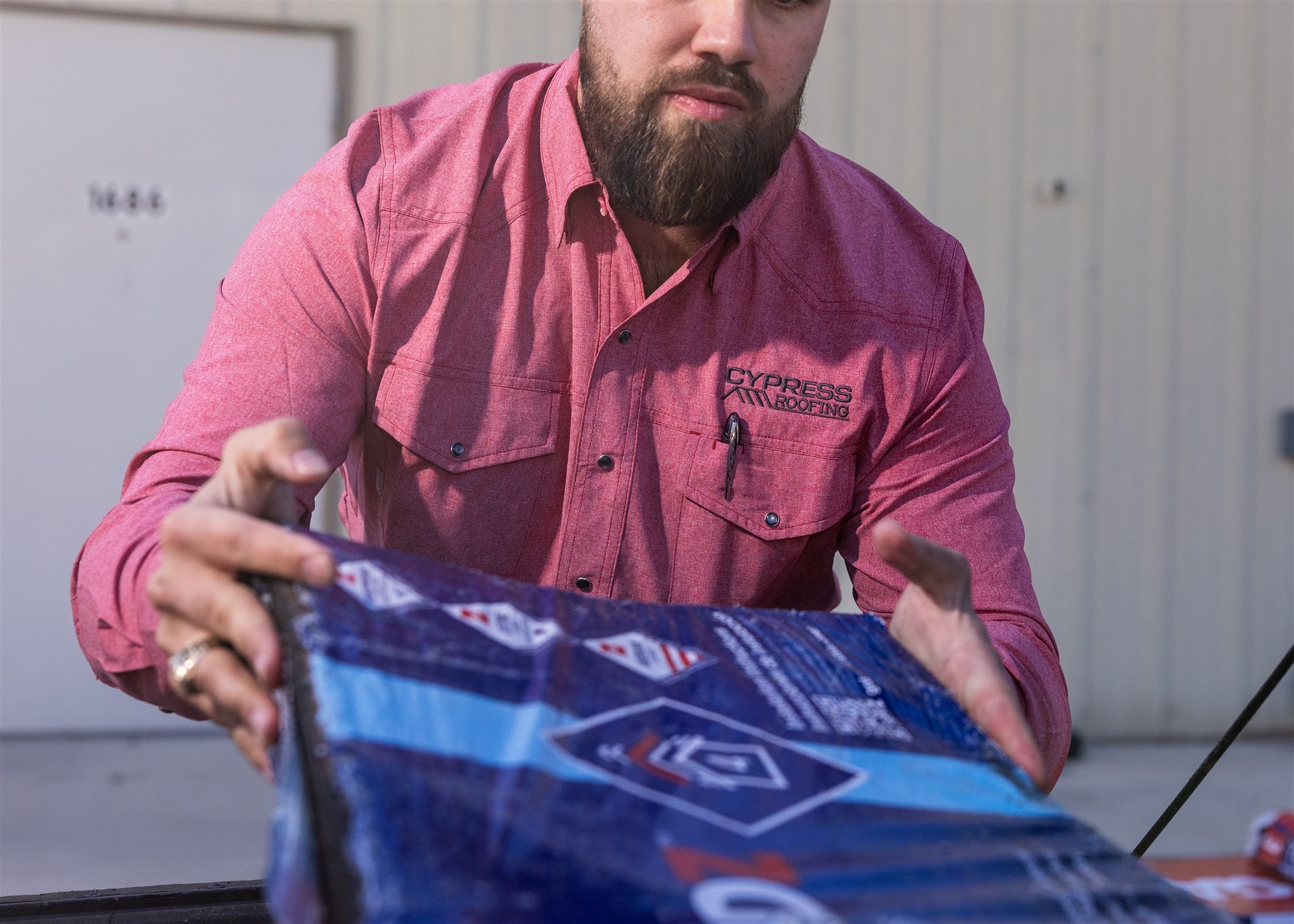 Printed banner design being inspected at a Texas print shop