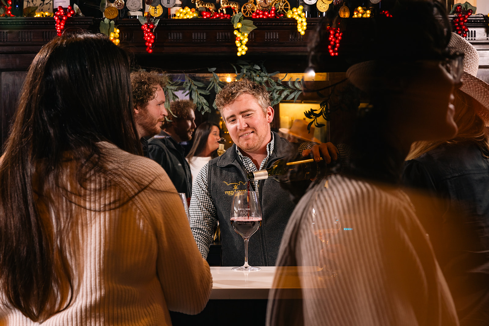 Guests in a Hill Country tasting room photographed for brand and hospitality marketing